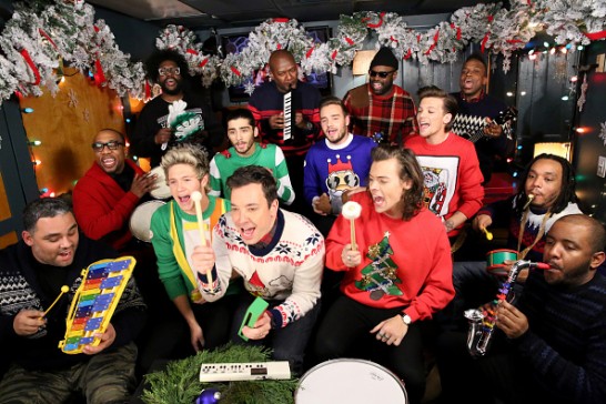 THE TONIGHT SHOW STARRING JIMMY FALLON -- Episode 0185 -- Pictured: (l-r) Host Jimmy Fallon and The Roots sing "Santa Claus is Coming to Town" with One Direction members Niall Horan, Zayn Malik, Liam Payne, Harry Styles and Louis Tomlinson during the music room bit on December 22, 2014 -- (Photo by: Douglas Gorenstein/NBC/NBCU Photo Bank)